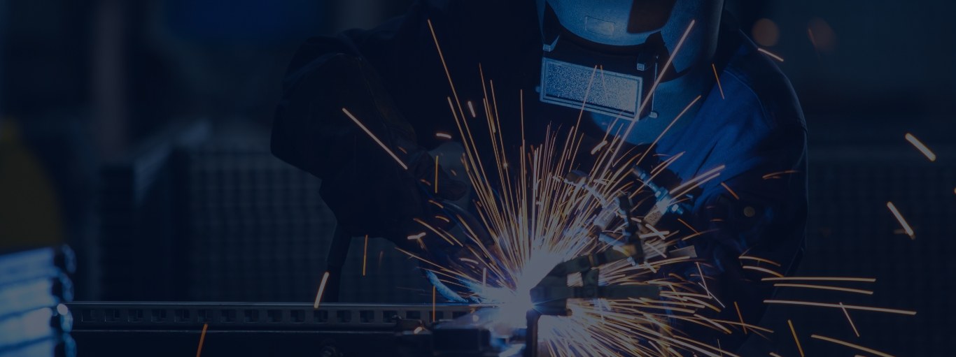 A welder at work, sparks flying